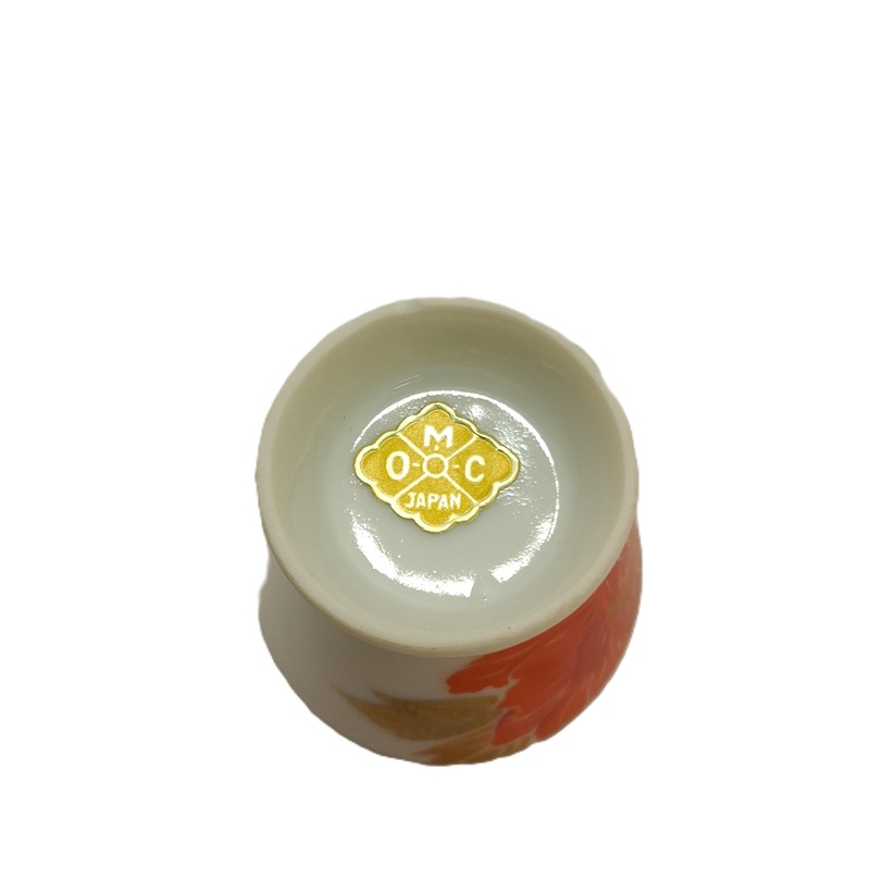 OMC foil label on sake cup closeup